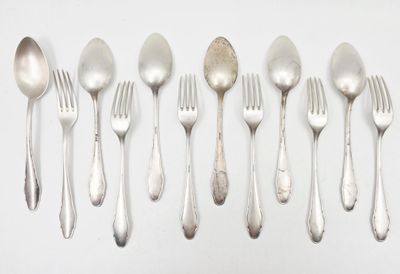 a lot of silver spoons and forks on the table