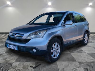the honda cr - v is parked in a garage with a checkered floor