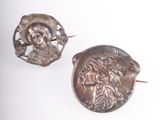 pair of antique roman coin earrings on white background with white background