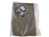 a bag of clothing that is sitting on a white surface