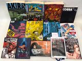 a lot of comic books that are on the table