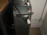 a machine that is sitting in a kitchen next to a counter