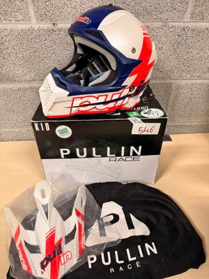 a helmet and a t - shirt sitting on a table