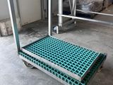 a close up of a dolly cart in a warehouse with boxes in the background
