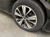 a close up of a black car with a white rim
