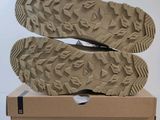 the soles of a pair of shoes are on top of a box