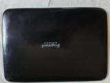 a black laptop computer sitting on a white table