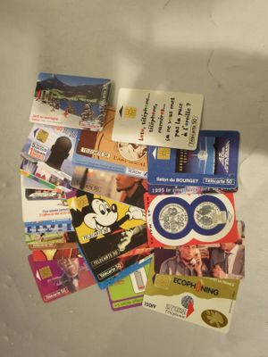 a lot of business cards on the refrigerator door