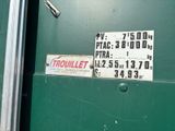 a sign on the door of a green bus