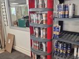 many cans of beer on the shelves in the store