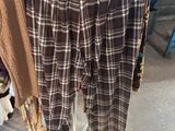 plaid pants hanging on a clothes rack in a clothing store