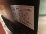a picture of a close up of a black refrigerator