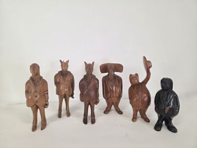 five wooden figurines of different types and sizes