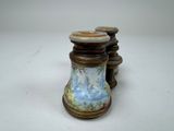 two vases that are sitting on a table