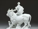white porcelain figurine of a woman on a horse with a child