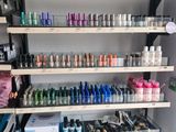 many bottles of nail polish on the shelves in the store