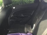 a purple blanket in the back seat of a car