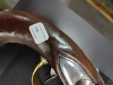 a close up of a chocolate banana with a tag on it