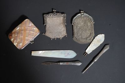 five different types of purses on a black surface