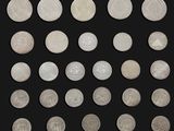 several different types of coins are shown on a black background