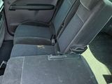 the back seats of a car with a seat belt in the back of it