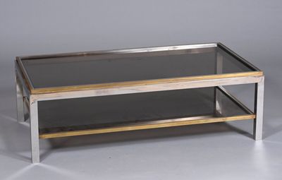 une photo d'une table basse avec un plateau en verre et un piètement en métal
