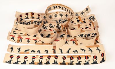 several pieces of fabric with designs on them on a white surface