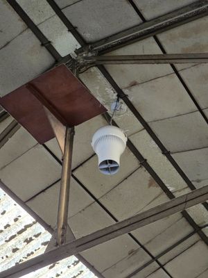 a camera mounted to the ceiling of a building