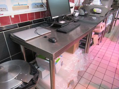 an image of a kitchen with a computer on a table