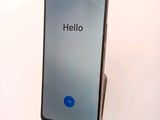 the back of a phone with a hello button on the screen