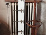 a picture of a coat rack and a coat rack in a room