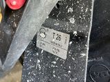 a close up of a red and black object on the ground