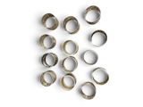 many rings that are arranged in a circle on a white surface