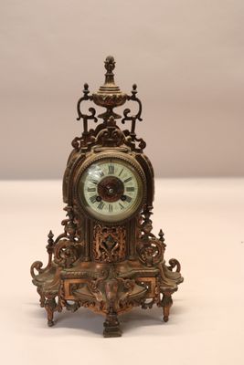 a small clock that is sitting on a table
