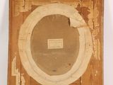 an old picture of a wooden frame with a picture on it