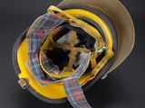 yellow helmet with tartan plaid ribbon on a black background