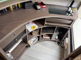 a view of a corner desk in a home office