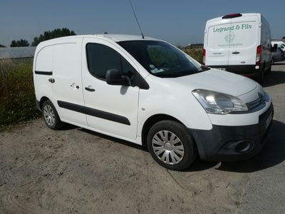 a white van that is parked on the side of the road