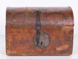 an old wooden chest with a lock on the front