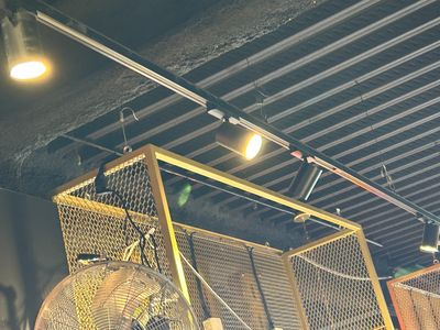 a fan that is hanging from the ceiling in a room
