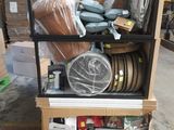 a cart that has many items on it in a warehouse