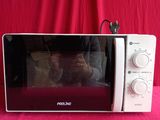 someone is taking a picture of their reflection in the microwave