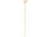 a close up of a stick with a pearl on it