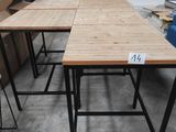 two tables that are sitting in the middle of a room