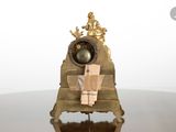 a clock that is sitting on a table with a clock on it