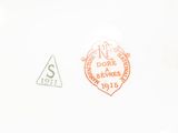 a close up of a plate with a stamp on it