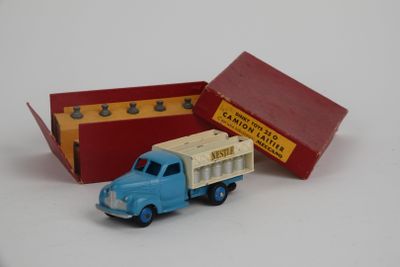 a toy truck that is sitting next to a box