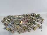 a lot of military vehicles that are on the table