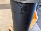 a black trash can sitting on a pallet in a store