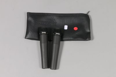 a pair of microphones sitting on top of a black bag
